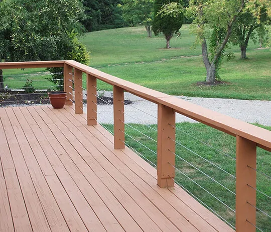 A serene wooden deck with a cozy bench